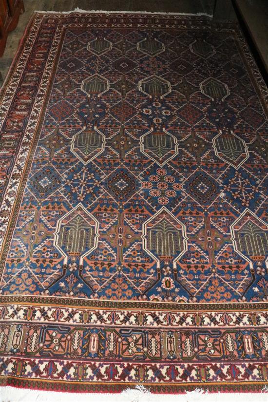 A large red & blue  Caucasian rug(-)
